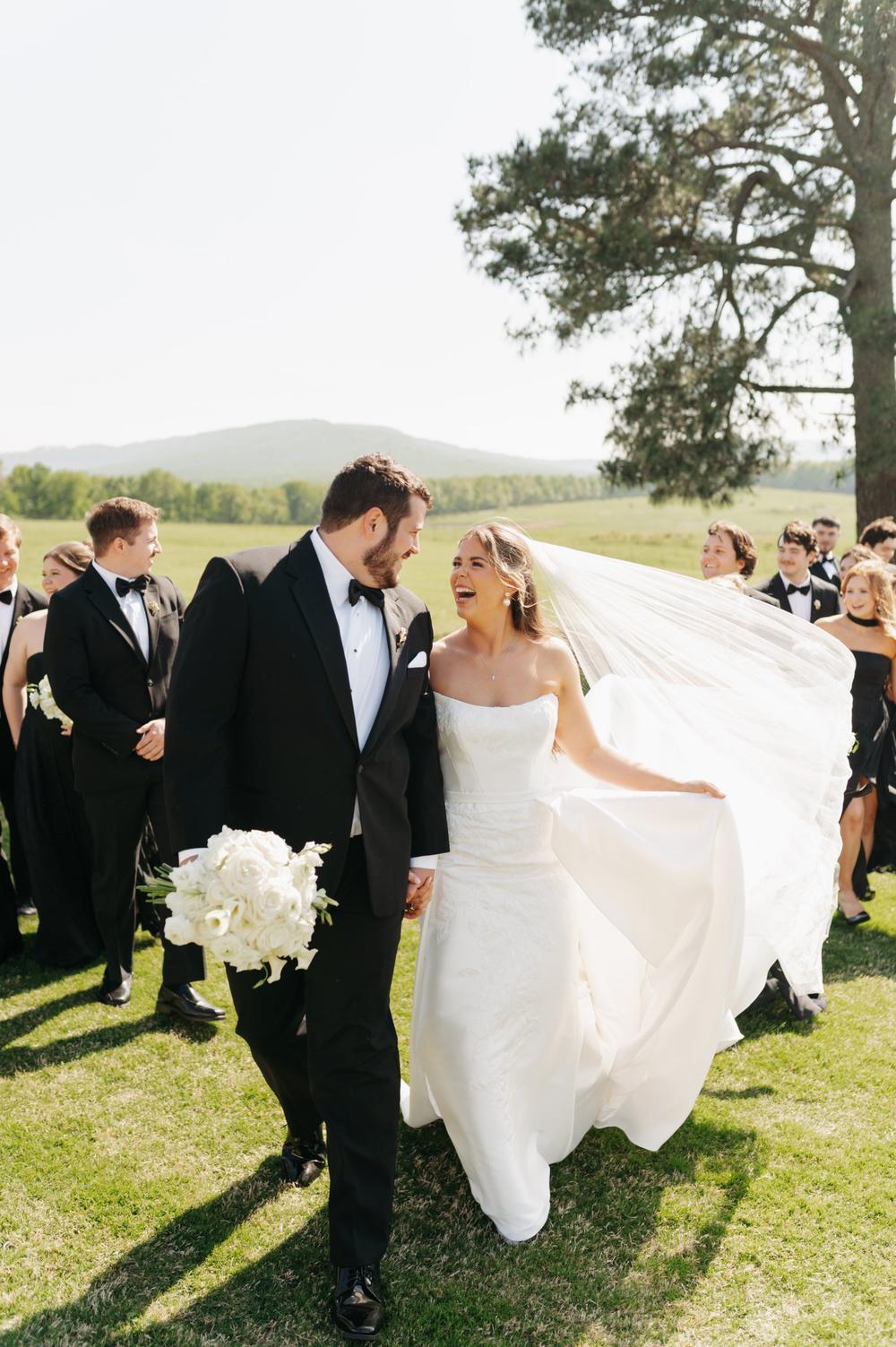 real bride lily in woodrow satin fit and flare sheath strapless wedding dress with lace detail and detachable overskirt