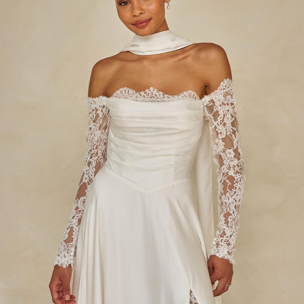 Ward lace off-shoulder modern wedding gown with scarf.